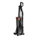A black and red Hoover upright vacuum cleaner with nozzles.