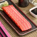 A plate with vegan tuna sashimi on it.