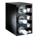 A black Dispense-Rite countertop cup dispenser with plastic cups and lids in it.