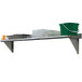 A stainless steel Advance Tabco wall shelf with a bucket on it.