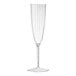 A clear plastic champagne flute with a stem.
