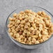 A bowl of Hometown Provisions roasted and salted extra large peanuts.