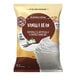 A white bag of Big Train Vanilla Bean Blended Creme Frappe Mix.