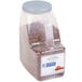 A white plastic container of McCormick Culinary Crushed Red Pepper.
