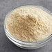 A bowl of McCormick Culinary Onion Powder.