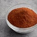 A bowl of McCormick Culinary Choice chili powder.