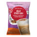 A white bag of Big Train Decaf Spiced Chai Tea Latte Mix with 4 packets inside.