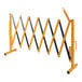A yellow and black Vestil Expand-A-Gate safety barrier with a handle.