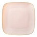 A square pink plastic plate with a gold border.