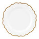 A white plastic plate with gold scalloped bands around the edge.