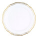 A Posh Setting white plastic plate with gold trim.