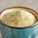 A bowl of McCormick Culinary Lemon and Pepper Seasoning Salt on a table.