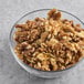 A bowl of Hometown Provisions raw walnut halves and pieces.