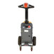 A grey and orange Vestil electric tugger with wheels and a handle.