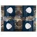 A table set with navy Posh Setting charger plates, gold cutlery, and blue and gold place settings.