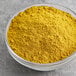 A bowl of McCormick Culinary Curry Powder.