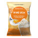 A white bag of Big Train Orange Cream Kidz Kreamz Blended Creme Frappe Mix.