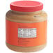 A REESE'S peanut butter jar with a red lid.