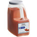A plastic container of red powder labeled "McCormick Culinary Extra Fancy Paprika"