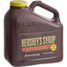 A brown plastic jug of Hershey's Special Dark Chocolate Syrup with a yellow lid.