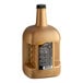 A large bottle of DaVinci Gourmet Caramel Flavoring Sauce with gold liquid inside.