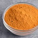 A bowl of McCormick Culinary Korean BBQ Gochujang Style Seasoning, a powdered orange spice blend.