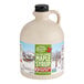A Butternut Mountain Farm jug of maple syrup with a handle.
