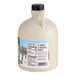 A white jug of Butternut Mountain Farm Vermont maple syrup.