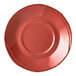A Libbey round barn red porcelain saucer with a small rim.