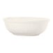 A close up of a Libbey Porcelana bright white porcelain nappie bowl with a white rim.