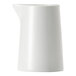 A Libbey Porcelana white porcelain creamer pitcher with a handle.