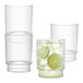 Three Tossware Reserve Tritan plastic fluted glasses with lime slices in them.