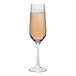 A Tossware Reserve Go-To plastic flute with pink champagne.