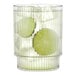 A Tossware plastic fluted tumbler with lime slices in it.