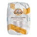 A white and yellow bag of Caputo 0 Aria Flour with text and images of a chef and mother sourdough.