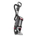 A black and red Sanitaire bagless upright vacuum cleaner.