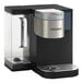 A white Keurig commercial single serve pod coffee maker with black and silver accents.