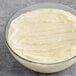 A bowl of white liquid beef tallow.