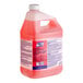 A bottle of Clean Quick Closed Loop Quaternary Sanitizer Concentrate with a white cap.