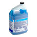 A blue container of Cascade Professional rinse aid concentrate with a white label.