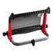 A red and black wall-mount Tork Performance W1 wiper roll dispenser.