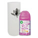 A white Air Wick Freshmatic device with a white and purple label with a pink and purple bottle attached.