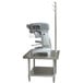A stainless steel Advance Tabco mixer table with a machine on it.