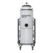 A white Nilfisk industrial wet / dry vacuum cylinder with black text and wheels.