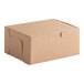 A brown Baker's Lane cake box with lid.