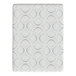 A close-up of a white surface with a blue circle pattern on a Rize Home Cool Flex Plus mattress.
