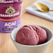 A bowl of Sambazon Organic Acai Sorbet with a spoon.