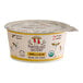 A close up of a white and yellow Painterland Sisters Vanilla Bean Organic Skyr Yogurt container.