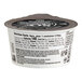 A So Delicious Blueberry Coconut Milk Yogurt cup with a black label.