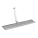 A metal Estella pressure plate with a long handle.